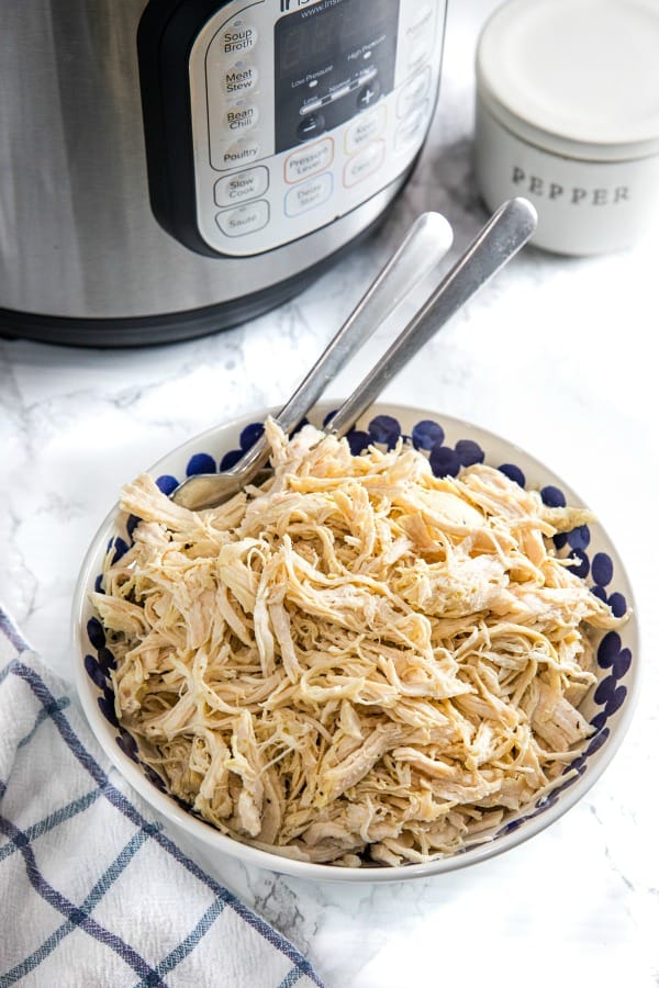 Easy Instant Pot Shredded Chicken is a deliciously easy recipe starter perfect for freezing. Perfect for quick sandwiches, quesadillas, rice dishes, and casseroles!