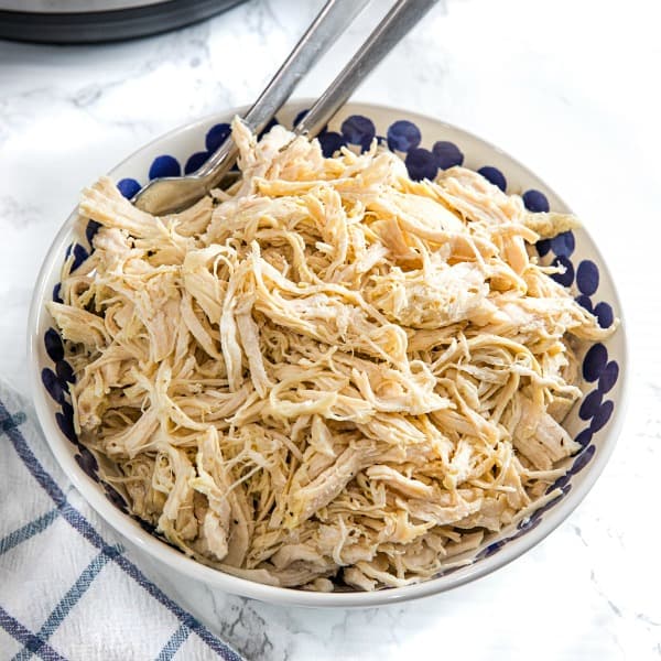 Easy Instant Pot Shredded Chicken is a deliciously easy recipe starter perfect for freezing. Perfect for quick sandwiches, quesadillas, rice dishes, and casseroles!