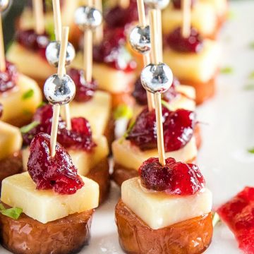 Sheet Pan Smoked Sausage with Cranberry Bites made with cubes of white cheddar and whole cranberry sauce. They're incredibly easy and perfect for holidays or an appetizer for any gathering! #mustlovehomecooking