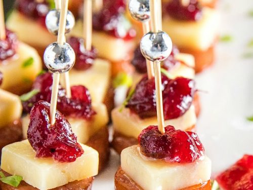 Sheet Pan Smoked Sausage with Cranberry Bites made with cubes of white cheddar and whole cranberry sauce. They're incredibly easy and perfect for holidays or an appetizer for any gathering! #mustlovehomecooking