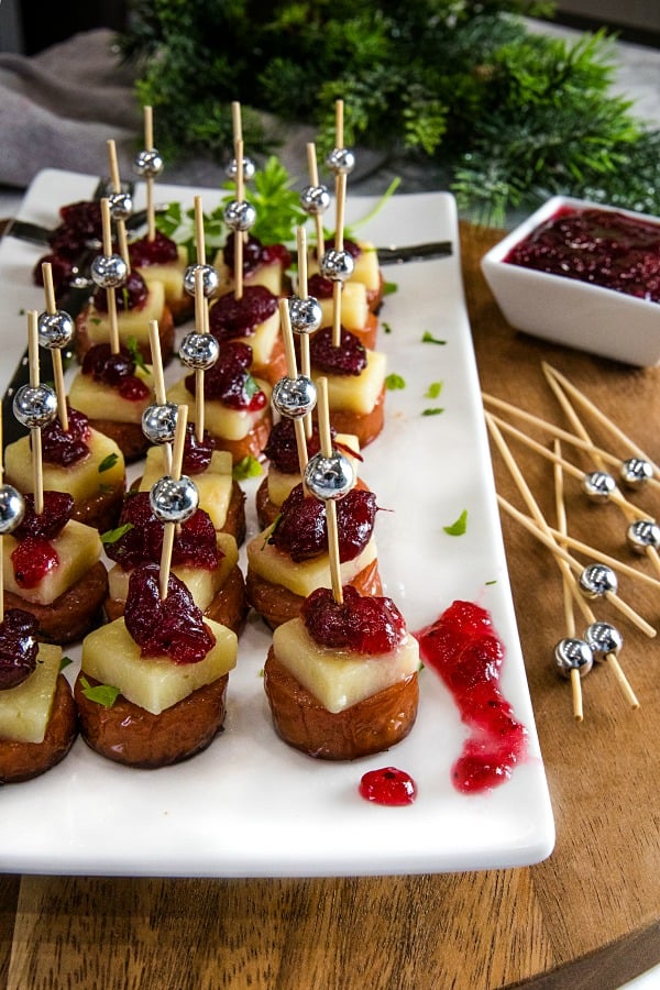 Sheet Pan Smoked Sausage with Cranberry Bites made with cubes of white cheddar and whole cranberry sauce. They're incredibly easy and perfect for holidays or an appetizer for any gathering! #mustlovehomecooking