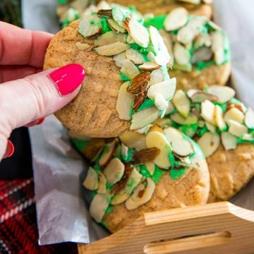 Easy to make Double Almond Butter Cookies - shortbread cookie taste dressed for the holidays with colored chocolate and a sprinkle of almonds! #mustlovehomecooking