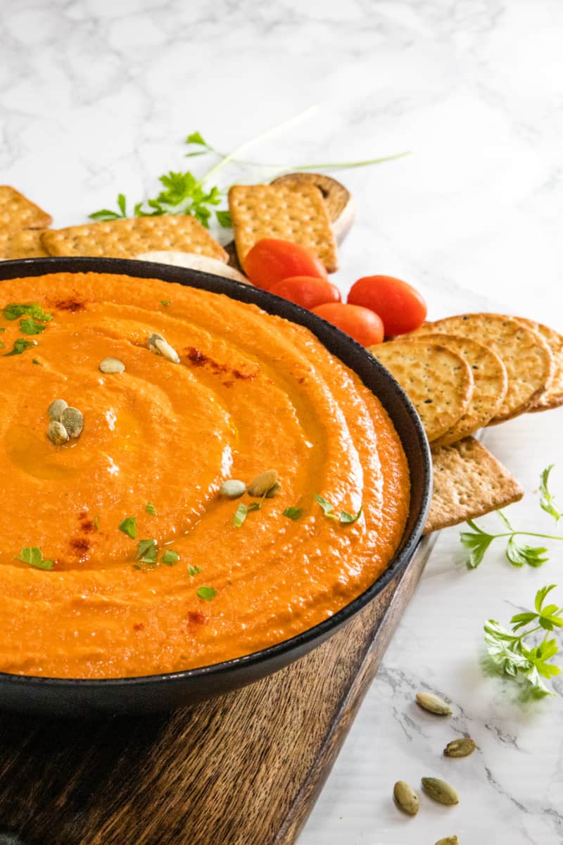 Easy Roasted Red Pepper Hummus recipe with tahini, chickpeas and spices is healthy, simple to make and so much tastier than store bought. Ready in 5 minutes! #nustlovehomecooking