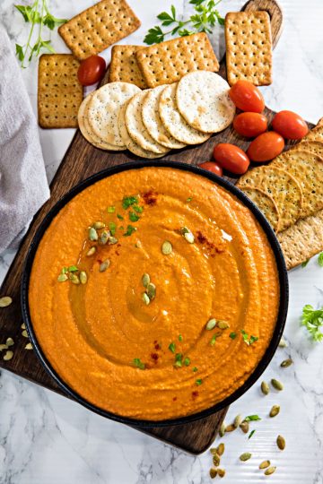 Easy Roasted Red Pepper Hummus recipe with tahini, chickpeas and spices is healthy, simple to make and so much tastier than store bought. Ready in 5 minutes!
