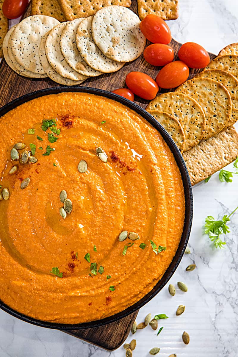 Easy Roasted Red Pepper Hummus recipe with tahini, chickpeas and spices is healthy, simple to make and so much tastier than store bought. Ready in 5 minutes! #nustlovehomecooking