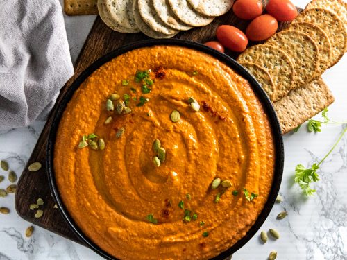 Easy Roasted Red Pepper Hummus recipe with tahini, chickpeas and spices is healthy, simple to make and so much tastier than store bought. Ready in 5 minutes! #nustlovehomecooking
