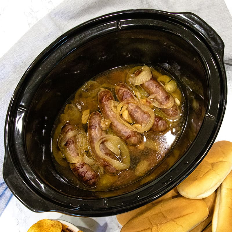 Full of malt and garlic flavors, these slow cooker beer brats are one of the easiest and tastiest crock pot recipes you'll ever make.