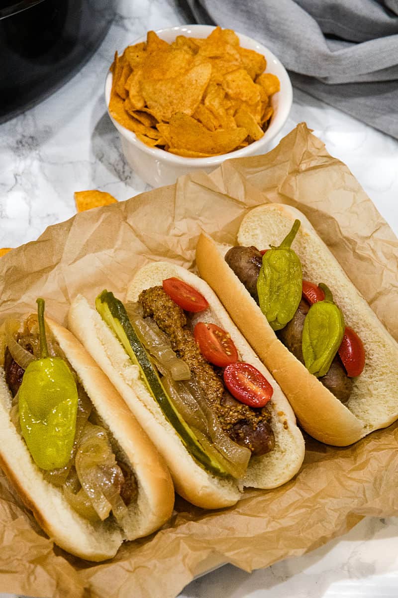 Full of malt and garlic flavors, these slow cooker beer brats are one of the easiest and tastiest crock pot recipes you'll ever make. #mustlovehomecooking