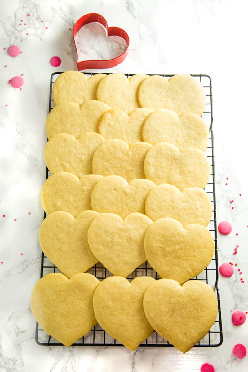 undecorated heart cookies cooling on wire rack