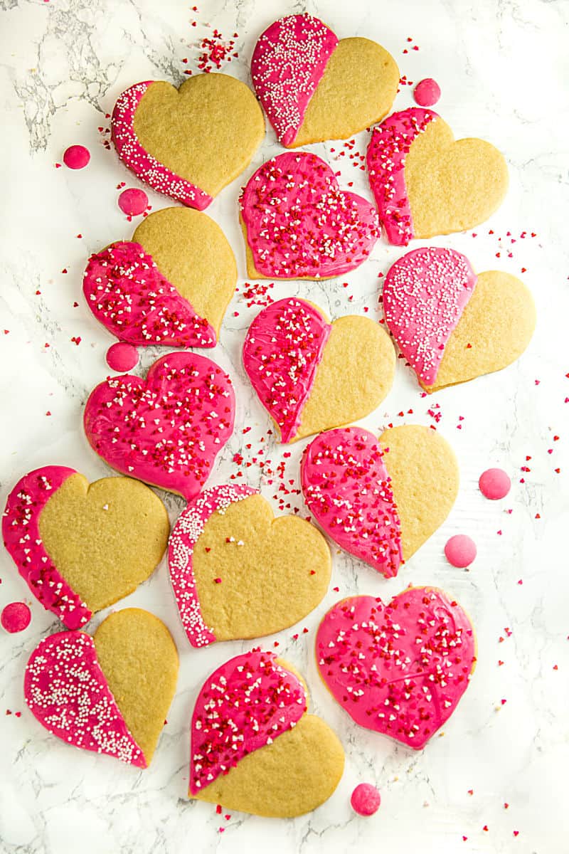 Crispy sugar cookies cut-outs decorated for your Valentine! Easy recipe for any occasion. #mustlovehomecooking
