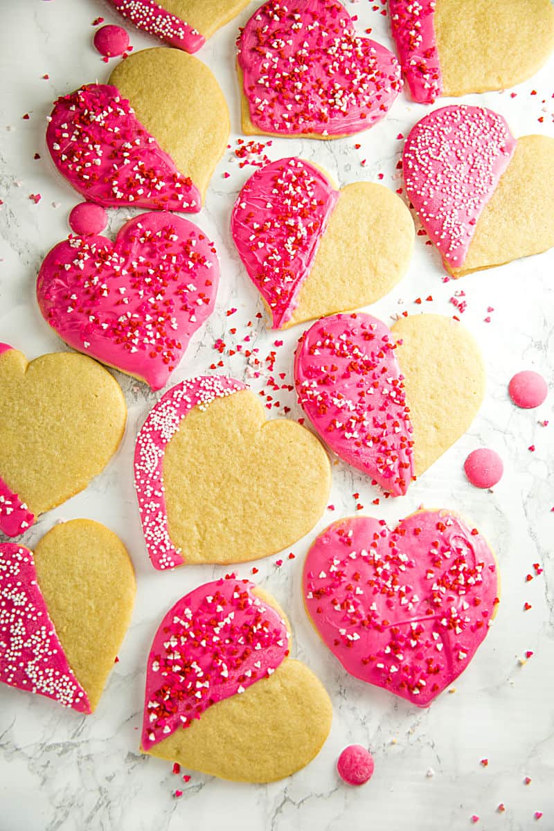 Crispy sugar cookies cut-outs decorated for your Valentine! Easy recipe for any occasion. #mustlovehomecooking