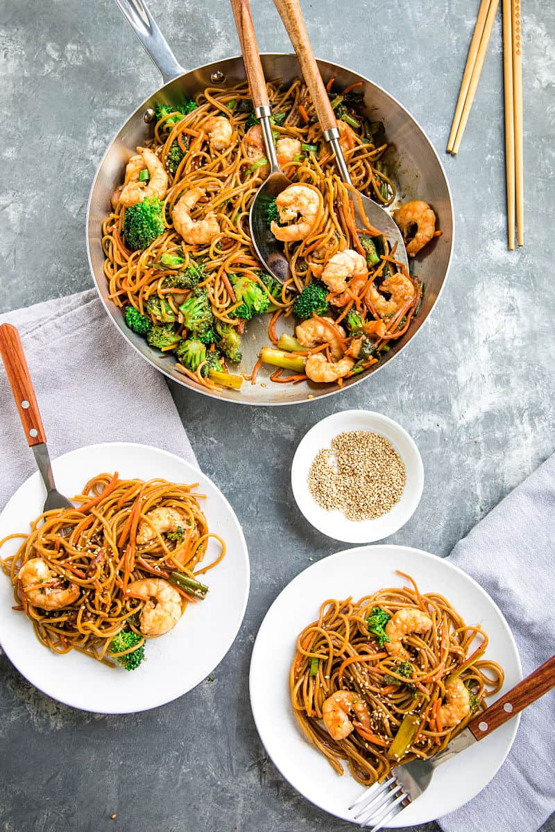 Quick and easy pan fried shrimp and vegetables, tossed with pasta and coated with an addictive spicy sesame sauce.