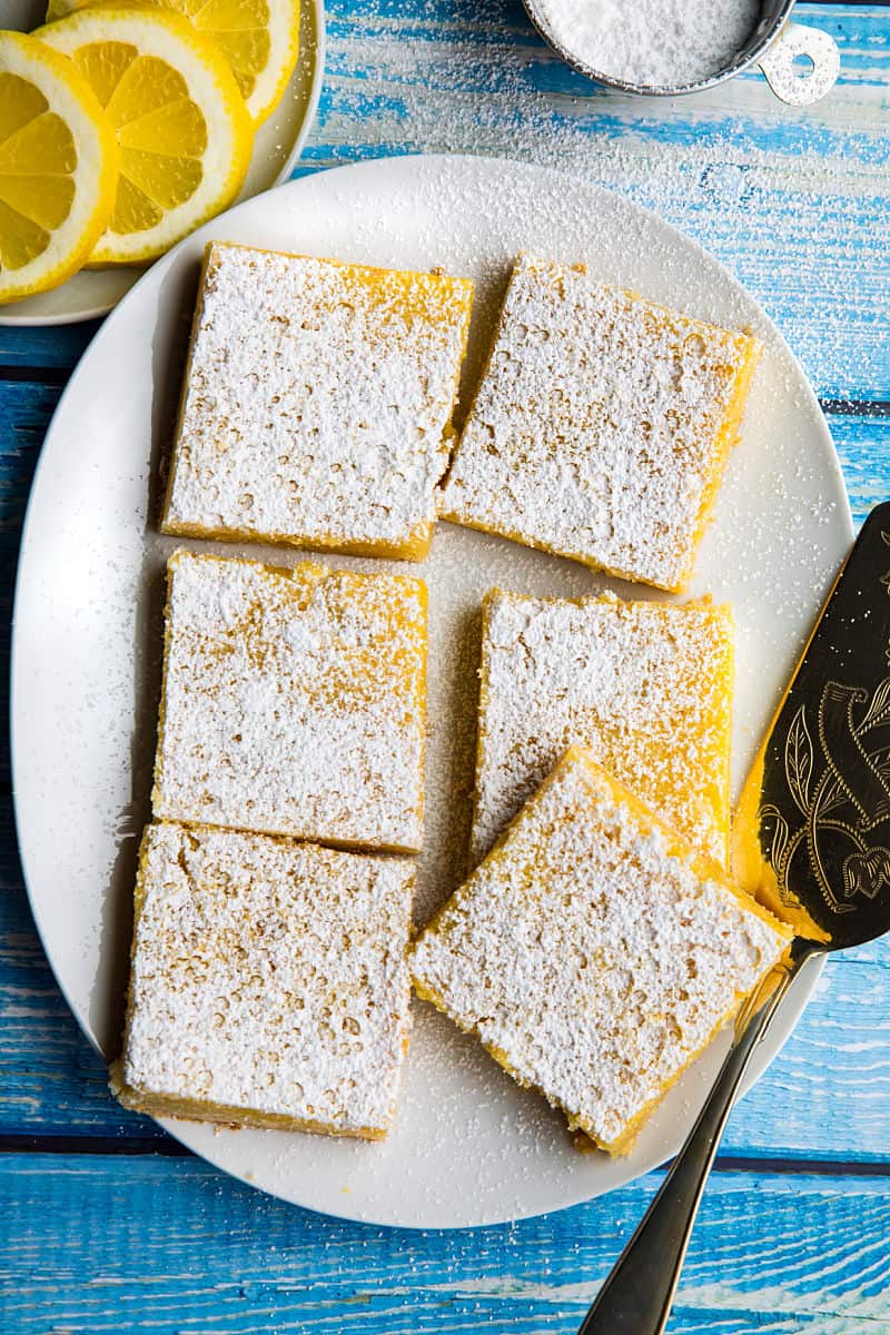 Bright and zippy lemons bars with a buttery shortbread crust and tangy lemon filling. Easy to make and totally delicious! #mustlovehomecooking