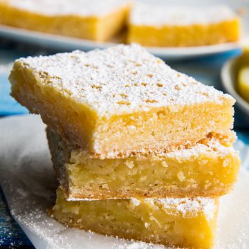 Bright and zippy lemons bars with a buttery shortbread crust and tangy lemon filling. Easy to make and totally delicious! #mustlovehomecooking