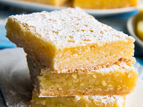 Bright and zippy lemons bars with a buttery shortbread crust and tangy lemon filling. Easy to make and totally delicious! #mustlovehomecooking
