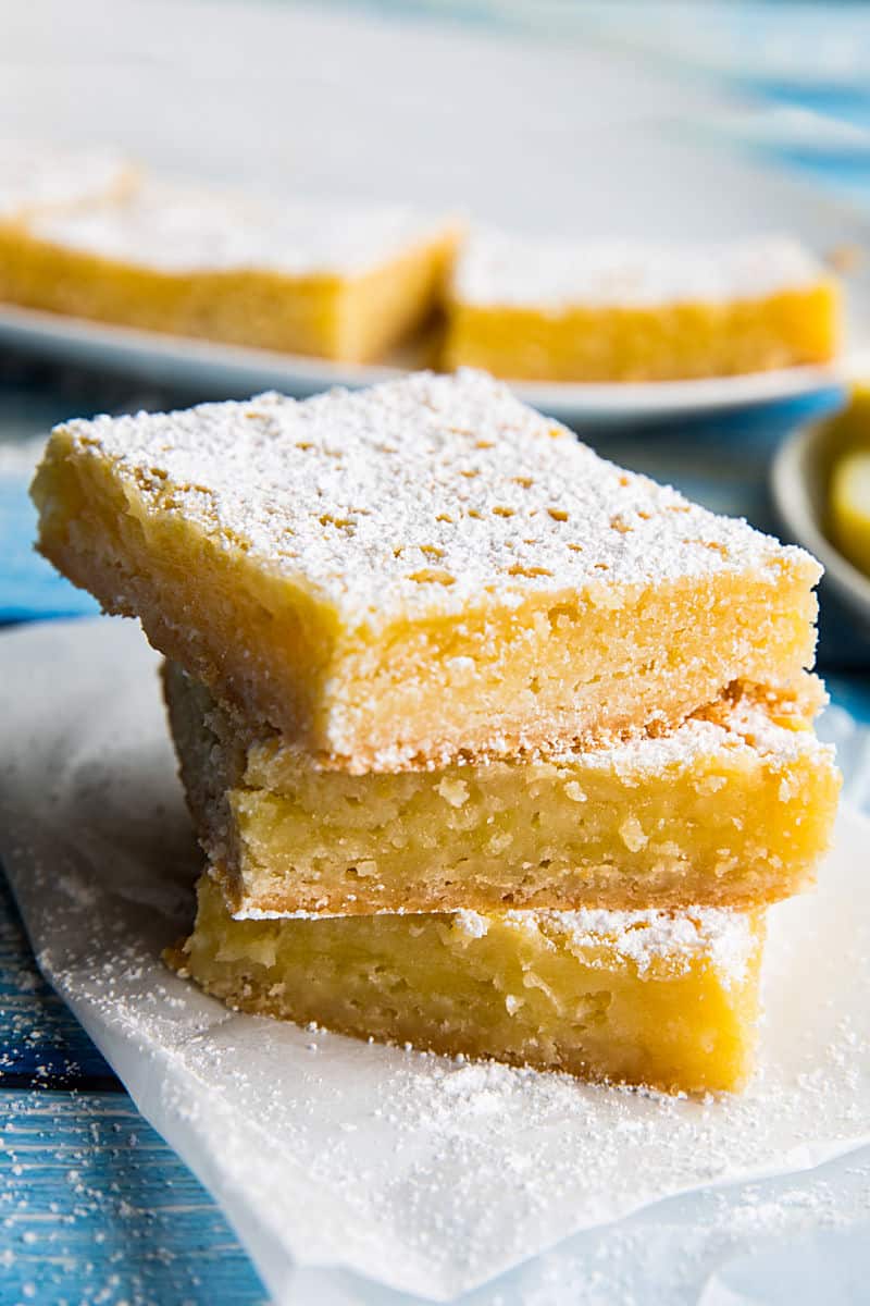 Bright and zippy lemons bars with a buttery shortbread crust and tangy lemon filling. Easy to make and totally delicious! #mustlovehomecooking