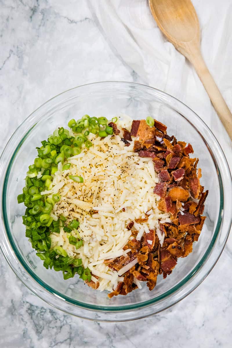 Easy Oven Hash Browns, crispy golden and loaded with bacon and cheese, are the stuff of breakfast dreams.