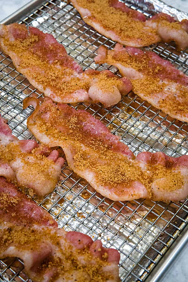 Spicy Sweet Oven Bacon, with brown sugar and spices, cooked perfectly crisp and delicious in the oven. So easy with no mess or splatter!