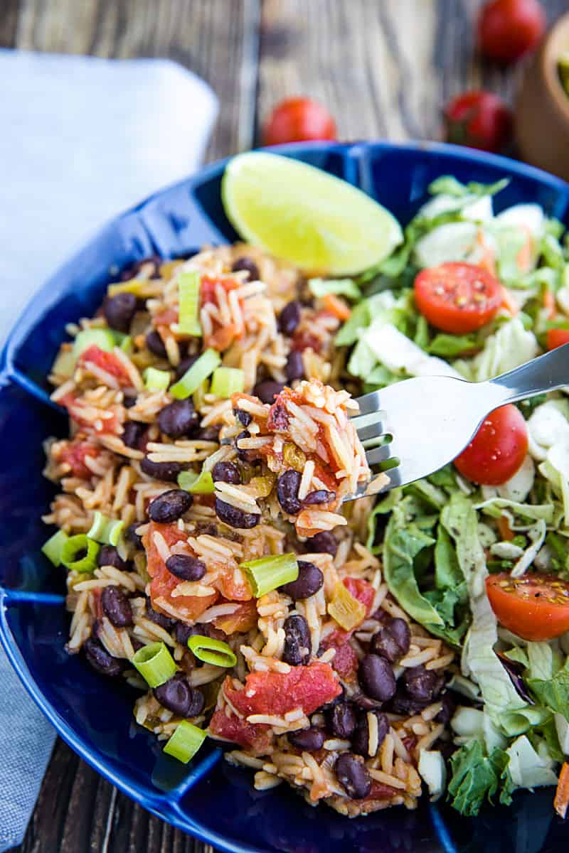 Instant Pot Black Beans and Rice is made quick and easy using a pressure cooker. Mildly spicy with green chilies and garlic, it's made from pantry staples and ready to serve in minutes. #mustlovehomecooking