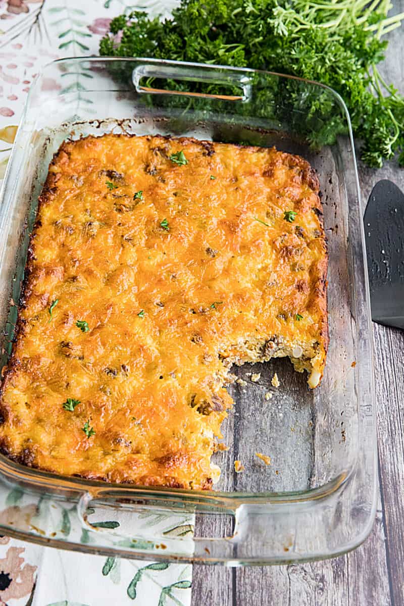 Hominy and Sausage Casserole is an easy, cheesy breakfast or supper bake. This hearty and nutritious comfort food can be made ahead too. #mustlovehomecooking