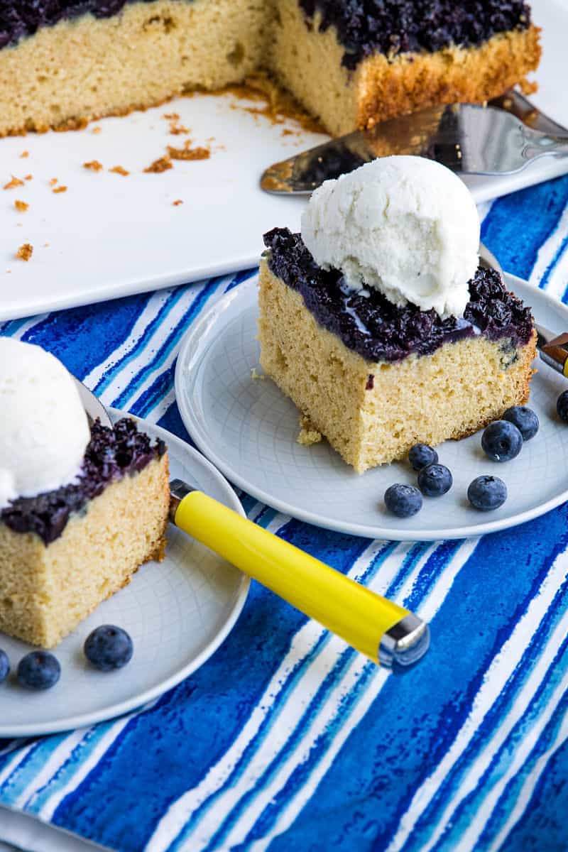 Made with fresh summer berries, this Easy Blueberry Upside Down cake is simple dessert anyone can make with blueberries caramelized under a layer of vanilla flavored cake #mustlovehomecooking