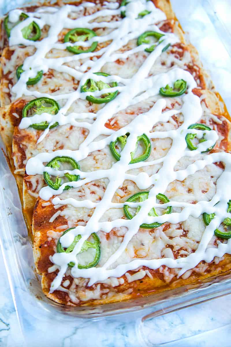 Chipotle Chicken Enchiladas made with shredded chicken, flour tortillas and a droolworthy chipotle enchilada sauce that takes this classic Mexican dish to a whole new level! #mustlovehomecooking