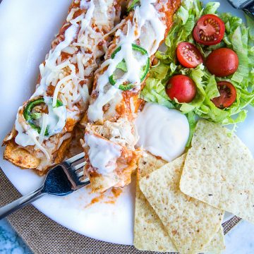 Chipotle Chicken Enchiladas made with shredded chicken, flour tortillas and a droolworthy chipotle enchilada sauce that takes this classic Mexican dish to a whole new level! #mustlovehomecooking