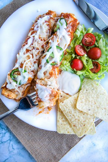 Chipotle Chicken Enchiladas made with shredded chicken, flour tortillas and a droolworthy chipotle enchilada sauce that takes this classic Mexican dish to a whole new level! #mustlovehomecooking