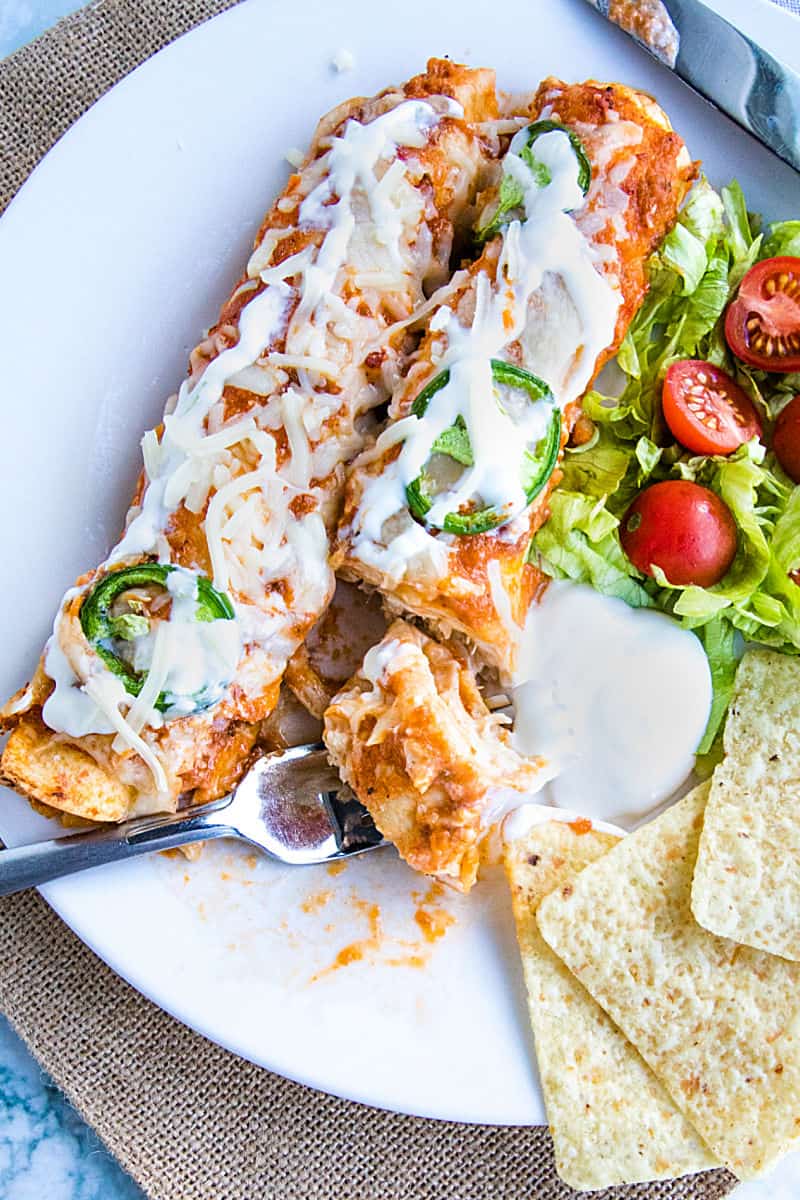 Chipotle Chicken Enchiladas made with shredded chicken, flour tortillas and a droolworthy chipotle enchilada sauce that takes this classic Mexican dish to a whole new level! #mustlovehomecooking