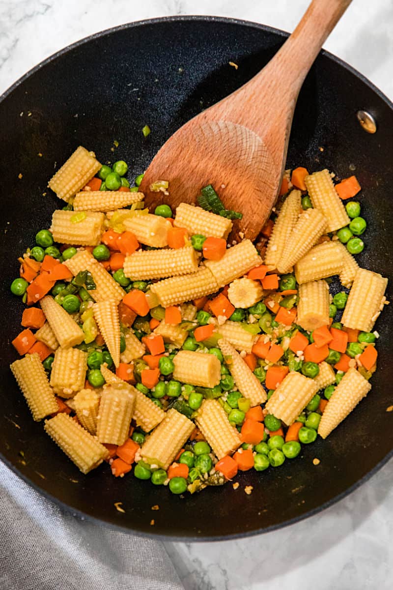 Garlic, ginger and vegetables for fried rice in wok#mustlovehomecooking