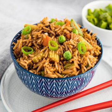 Best Ever Deluxe Fried Rice is a take-away style rice recipe packed with delicious flavor and healthy vegetables that's ready in just minutes! #mustlovehomecooking