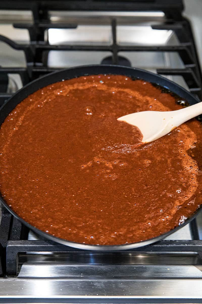 Simmering adobo sauce in cast iron skillet