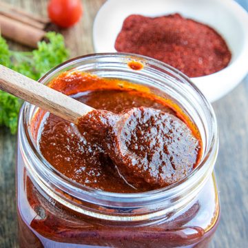 Mildly spicy homemade easy adobo sauce recipe is earthy, bursting with flavor and a classic Mexican cooking staple. Made with simple pantry ingredients. #mustlovehomecooking