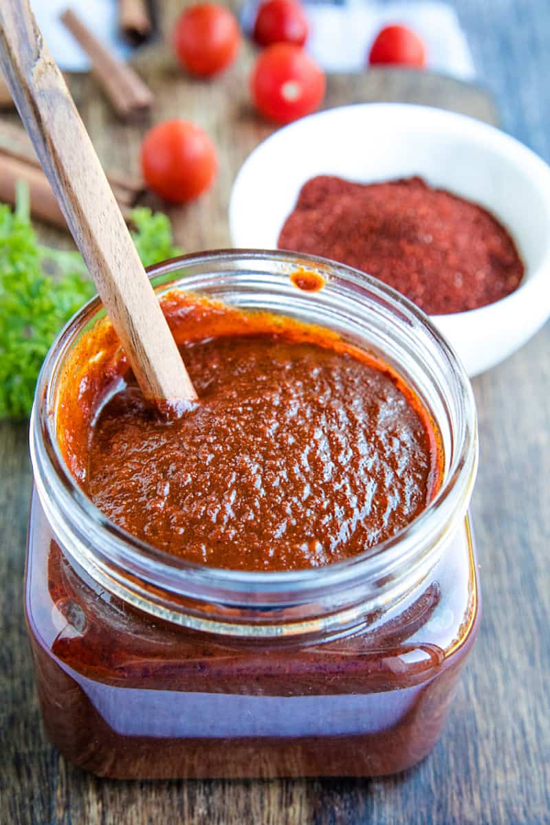 Mildly spicy homemade easy adobo sauce recipe is earthy, bursting with flavor and a classic Mexican cooking staple. Made with simple pantry ingredients. #mustlovehomecooking