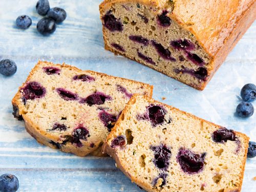 Blueberry Zucchini Bread is super simple and easy to make from scratch! This moist quick bread is made healthy with bursting blueberries, fresh zucchini and applesauce. #mustlovehomecooking