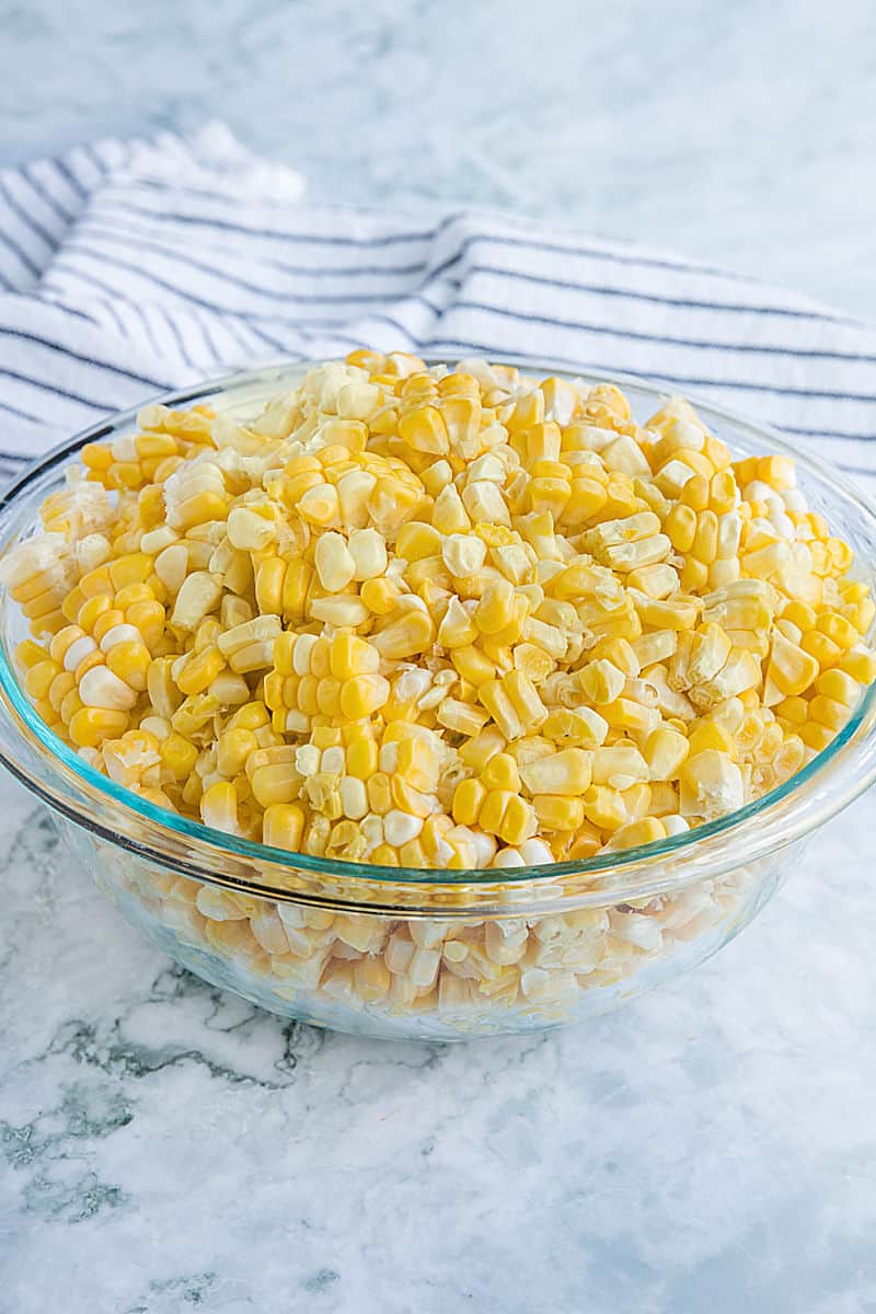 Fresh corn cut from the cob in large glass bowl