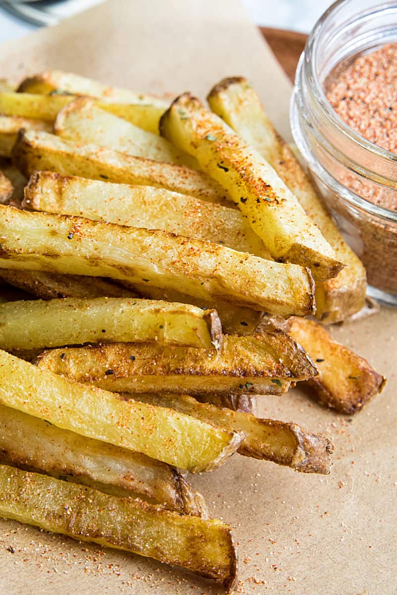 Chicken Salt Seasoning with chicken bouillon powder and pantry spices, is the ultimate seasoning salt for adding delicious umami flavor. Great on homemade french fries! #mustlovehomecooking