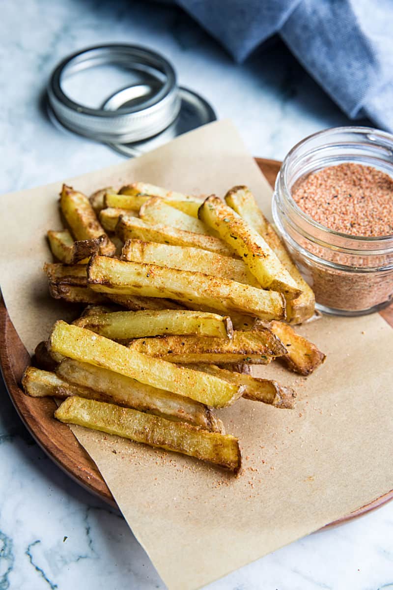 Chicken Salt Seasoning with chicken bouillon powder and pantry spices, is the ultimate seasoning salt for adding delicious umami flavor. Great on homemade french fries! #mustlovehomecooking