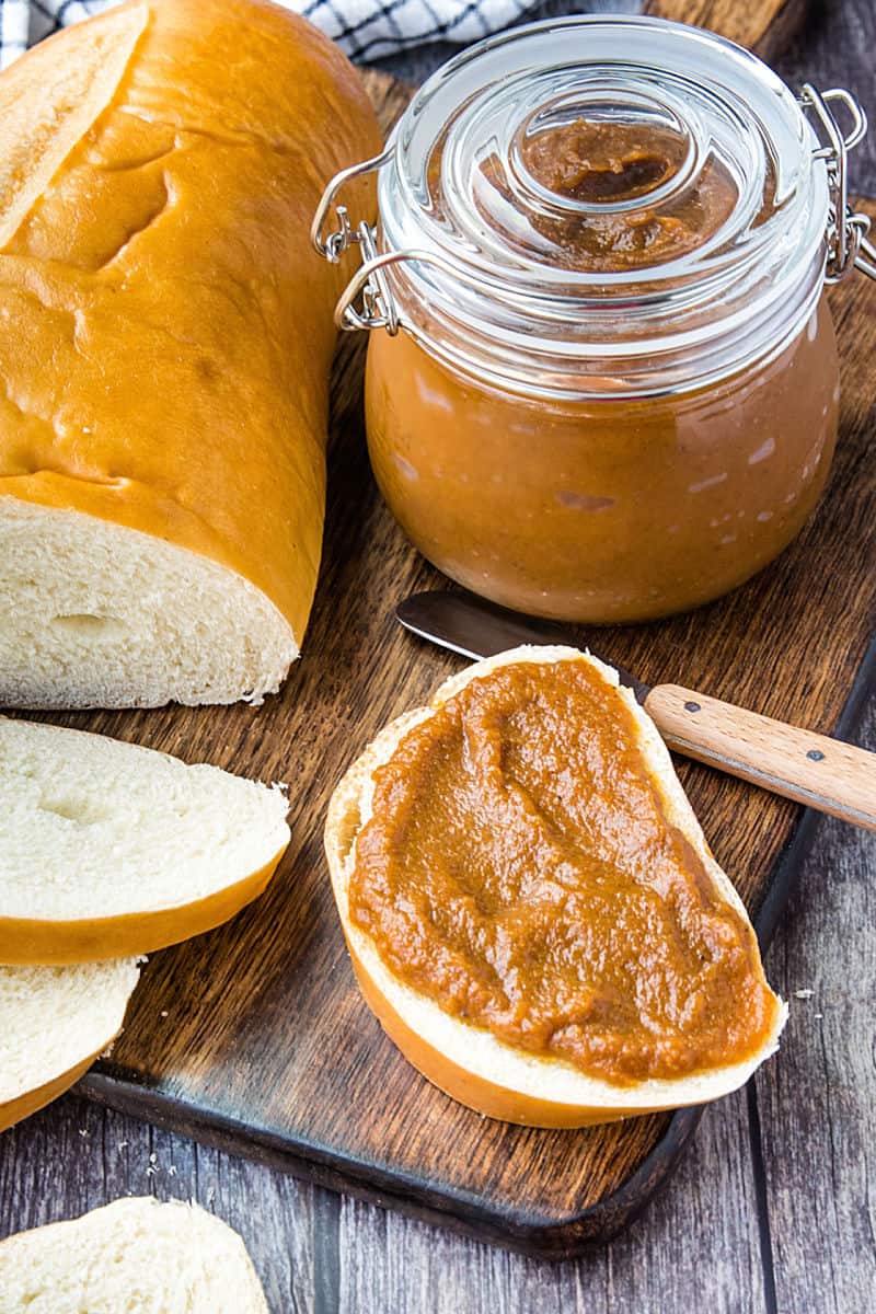 Homemade Pecan Pumpkin butter with pumpkin puree, brown sugar and pecan flavoring is smooth and delicious slathered atop toasted bread, rolls and bagels. #mustlovehomecooking