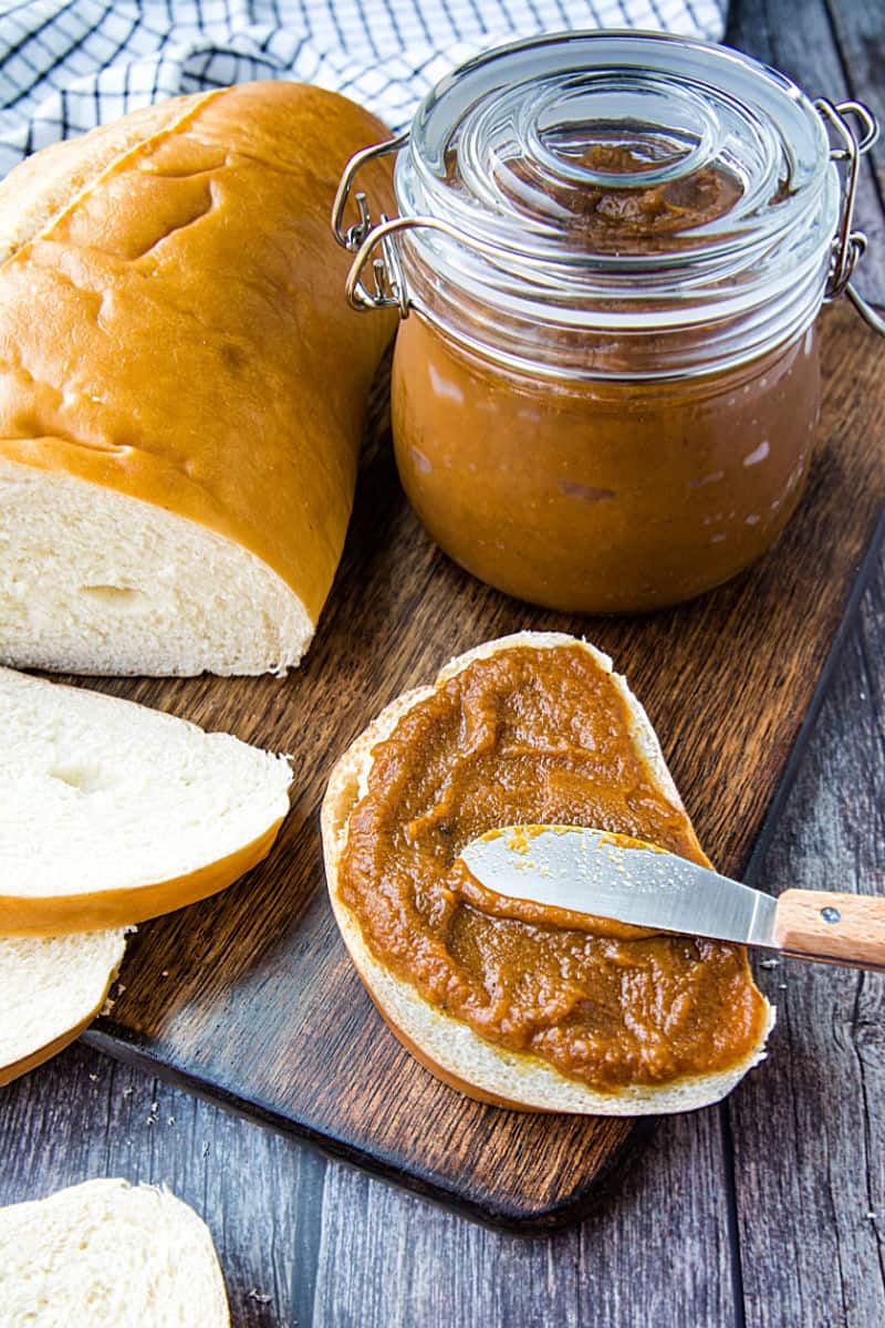 Homemade Pecan Pumpkin butter with pumpkin puree, brown sugar and pecan flavoring is smooth and delicious slathered atop toasted bread, rolls and bagels. #mustlovehomecooking