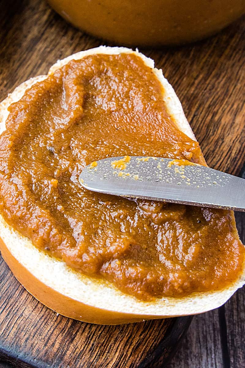 Homemade Pecan Pumpkin butter with pumpkin puree, brown sugar and pecan flavoring is smooth and delicious slathered atop toasted bread, rolls and bagels. #mustlovehomecooking