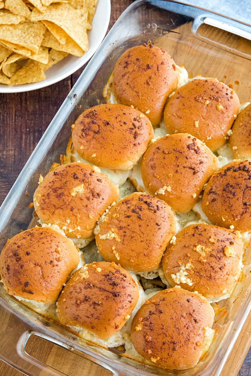 Hot and meaty Easy Garlic Meatball Sliders are oozing with melty cheese and garlic bread flavor. An irresistible game day and party snack! #mustlovehomecooking