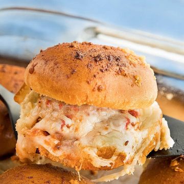 Hot and meaty Easy Garlic Meatball Sliders are oozing with melty cheese and garlic bread flavor. An irresistible game day and party snack! #mustlovehomecooking