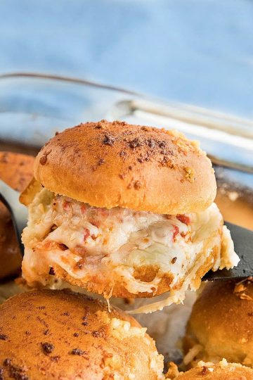 Hot and meaty Easy Garlic Meatball Sliders are oozing with melty cheese and garlic bread flavor. An irresistible game day and party snack! #mustlovehomecooking