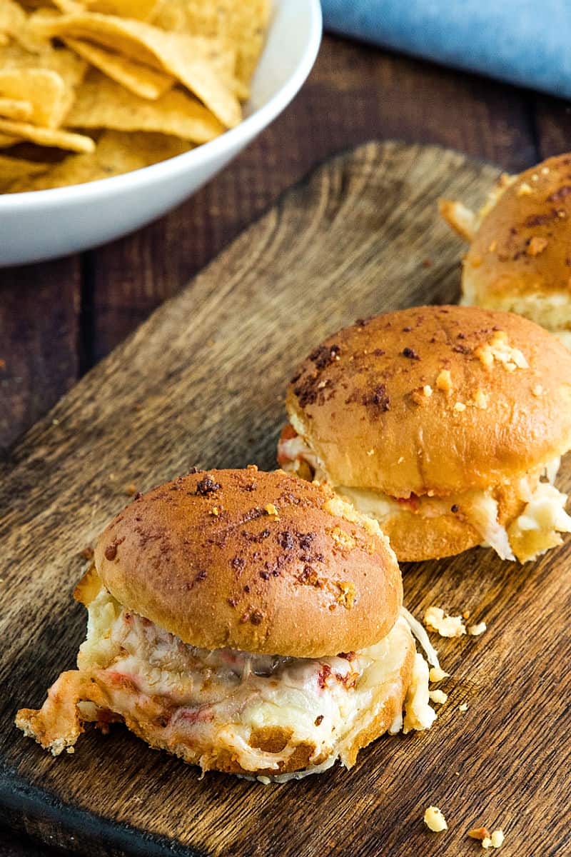 Hot and meaty Easy Garlic Meatball Sliders are oozing with melty cheese and garlic bread flavor. An irresistible game day and party snack! #mustlovehomecooking