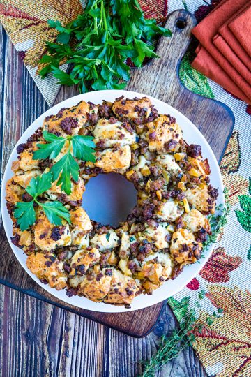 Pull-apart refrigerator biscuits meets sausage stuffing flavors in this irresistible twist from your classic Thanksgiving dish. #mustlovehomecooking