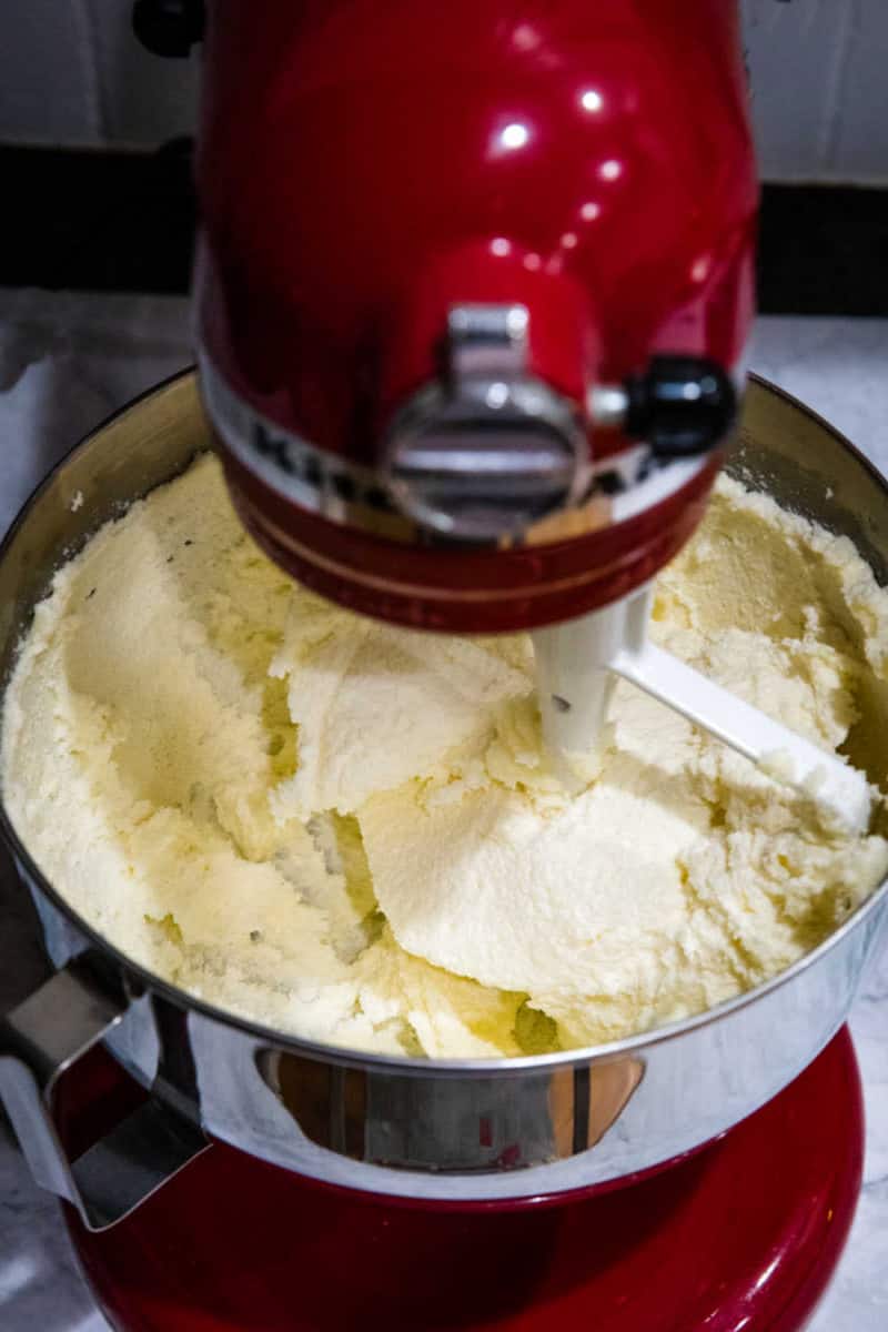 Creaming butter and sugar with red stand mixer and paddle attachment