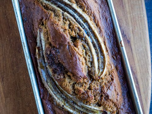 Easy "tried-and-true' homemade Banana Bread recipe that is the best way to use up over-ripe bananas. Made with brown sugar for a moist, dark loaf perfect to go with morning coffee or serve as dessert! #mustlovehomecooking