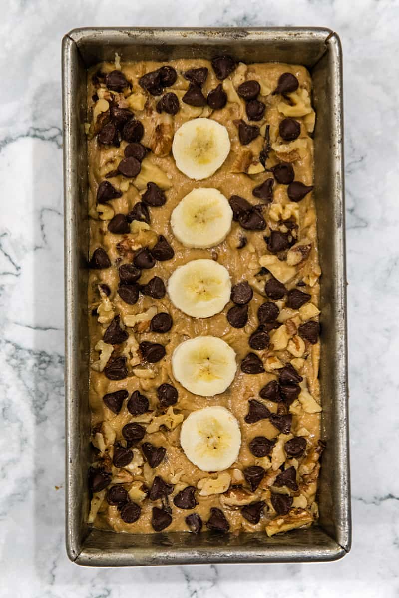 Chocolate Chip Banana Bread dough ready for the oven in a metal loaf pan.