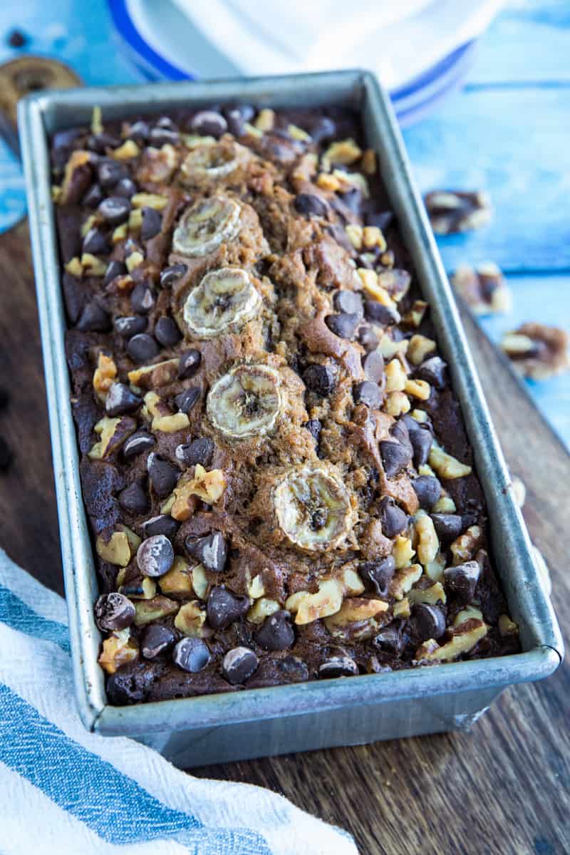 Banana Bread with Chocolate Chips and Walnuts is a super moist and tender quick bread perfect for using up ripe bananas. Great as a snack, dessert or breakfast with your morning coffee! #mustlovehomecooking